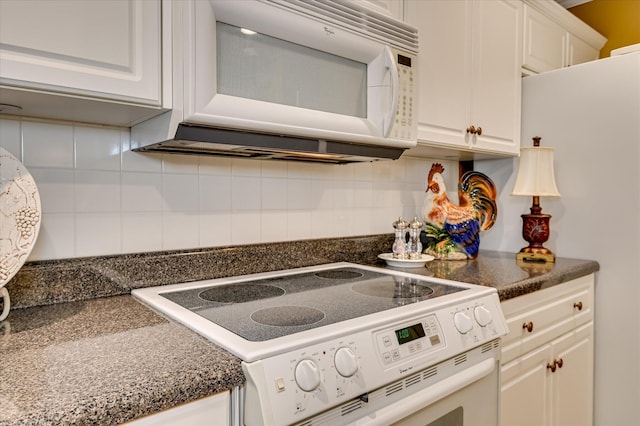 182 Andrews Br, North Augusta, SC 29860 - kitchen featuring white appliances, dark countertops, white cabinets, and decorative backsplash