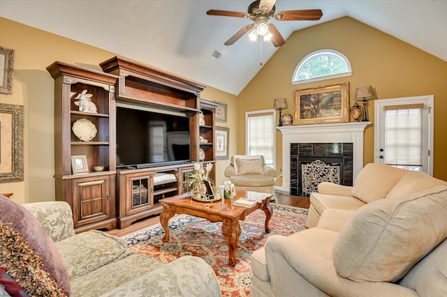 182 Andrews Br, North Augusta, SC 29860 - living room featuring ceiling fan, wood finished floors, a tile fireplace, and high vaulted ceiling