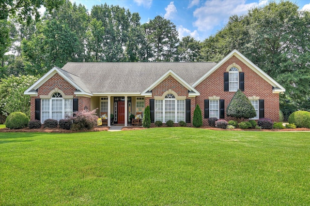 182 Andrews Br, North Augusta, SC 29860 - view of front of property with brick siding, a front lawn, and roof with shingles