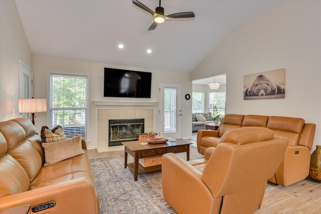 267 Fairway Dr, Mccormick, SC 29835 - living room with light wood-type flooring, ceiling fan, a tile fireplace, recessed lighting, and high vaulted ceiling