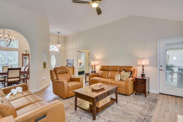 267 Fairway Dr, Mccormick, SC 29835 - living area featuring a chandelier, high vaulted ceiling, light wood-style floors, a ceiling fan, and baseboards