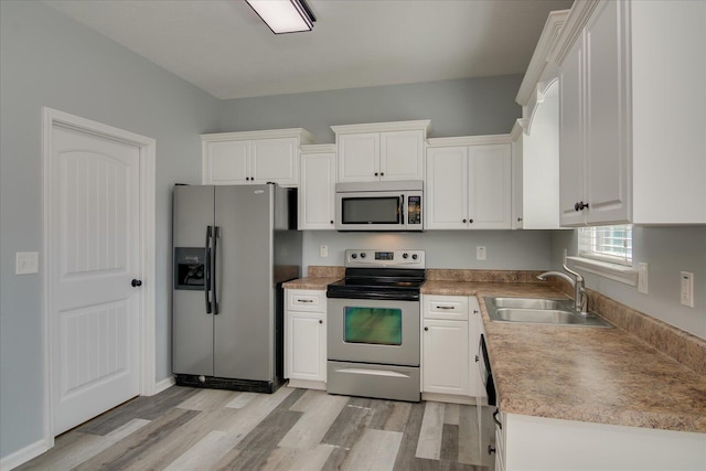 4909 Ashbrooke Way, Grovetown, GA 30813 - kitchen featuring stainless steel appliances, light wood-style flooring, white cabinets, and light countertops