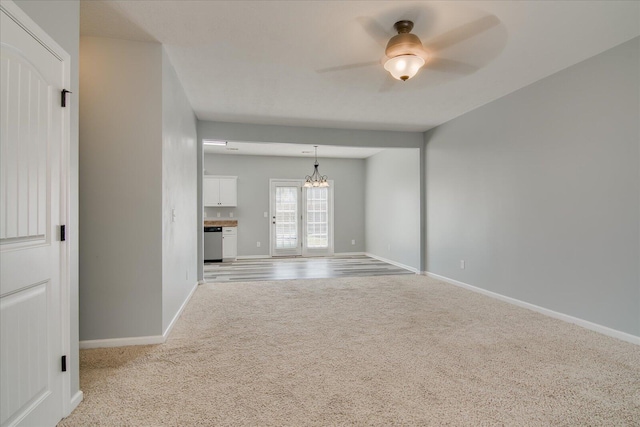 4909 Ashbrooke Way, Grovetown, GA 30813 - unfurnished living room featuring carpet, a chandelier, and ceiling fan