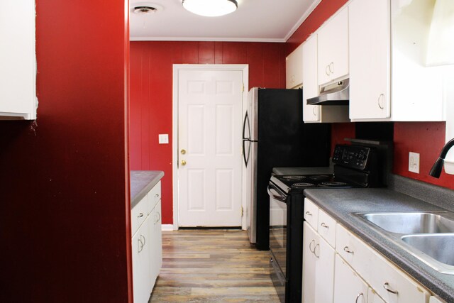 3711 Columbia Dr, Martinez, GA 30907 - kitchen featuring black electric range oven, under cabinet range hood, white cabinets, light wood finished floors, and dark countertops