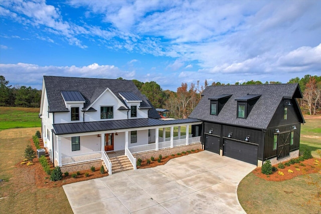 view of front facade with a porch, a garage, a front lawn, and cooling unit