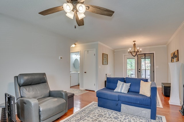 1414 Brookgreen Dr, North Augusta, SC 29841 - living room with light wood finished floors, crown molding, ceiling fan, and a chandelier