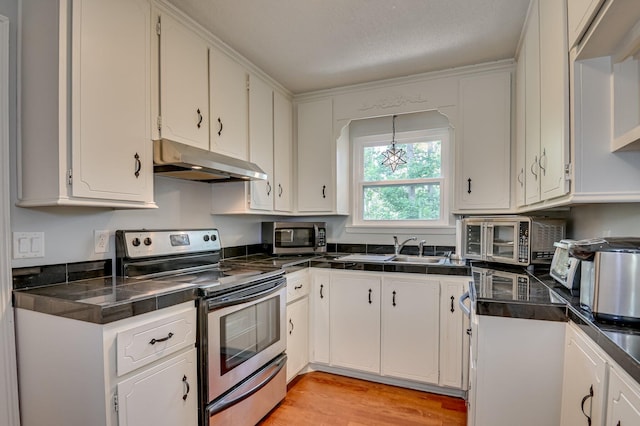 1414 Brookgreen Dr, North Augusta, SC 29841 - kitchen with appliances with stainless steel finishes, under cabinet range hood, dark countertops, and white cabinetry