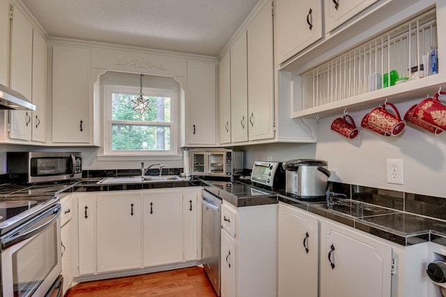 1414 Brookgreen Dr, North Augusta, SC 29841 - kitchen featuring appliances with stainless steel finishes, white cabinets, open shelves, and light wood-style floors