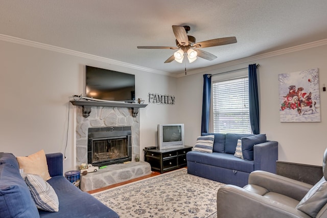 1414 Brookgreen Dr, North Augusta, SC 29841 - living room featuring ornamental molding, a ceiling fan, a textured ceiling, wood finished floors, and a fireplace