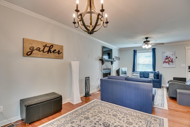 1414 Brookgreen Dr, North Augusta, SC 29841 - living room featuring crown molding, a chandelier, wood finished floors, and a ceiling fan