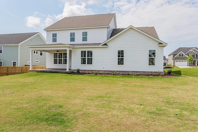 back of house featuring a lawn, a patio area, and ceiling fan