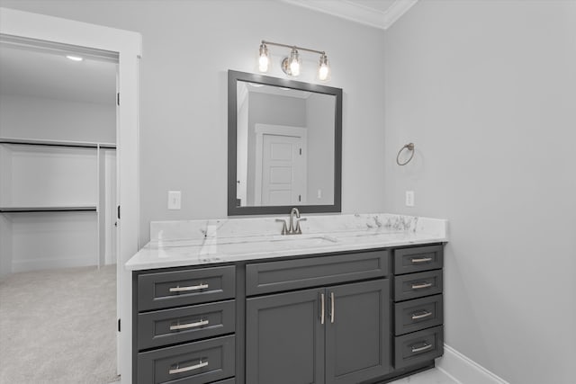 bathroom with vanity and ornamental molding