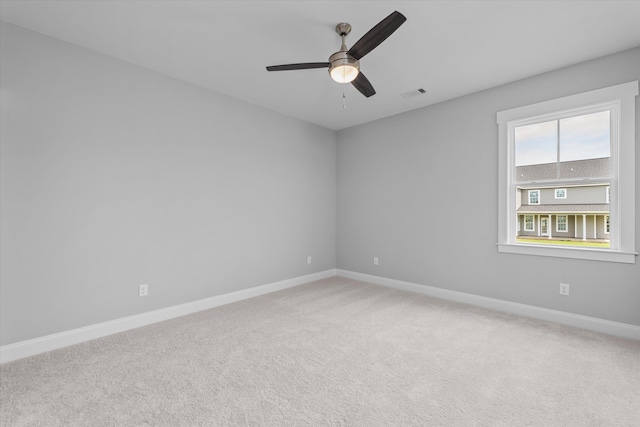 carpeted empty room with ceiling fan