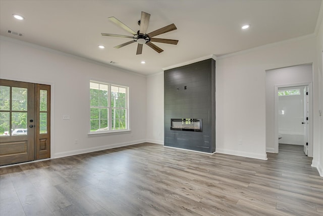 109 Dogwood Trl, Hephzibah, GA 30815 - unfurnished living room with crown molding, wood finished floors, baseboards, a fireplace, and a ceiling fan