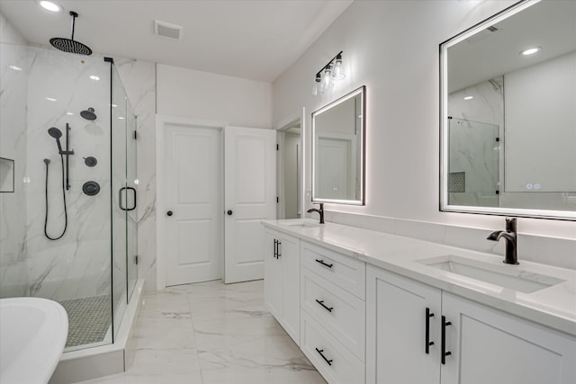 109 Dogwood Trl, Hephzibah, GA 30815 - bathroom featuring marble finish flooring, a marble finish shower, double vanity, recessed lighting, and a soaking tub