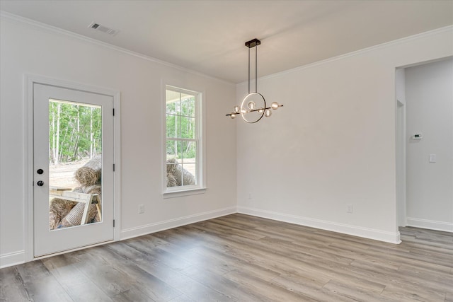 109 Dogwood Trl, Hephzibah, GA 30815 - unfurnished dining area with ornamental molding, a chandelier, wood finished floors, and baseboards