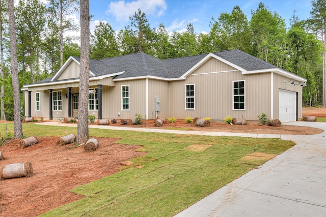 109 Dogwood Trl, Hephzibah, GA 30815 - view of front of home with a shingled roof, concrete driveway, a garage, and a front lawn