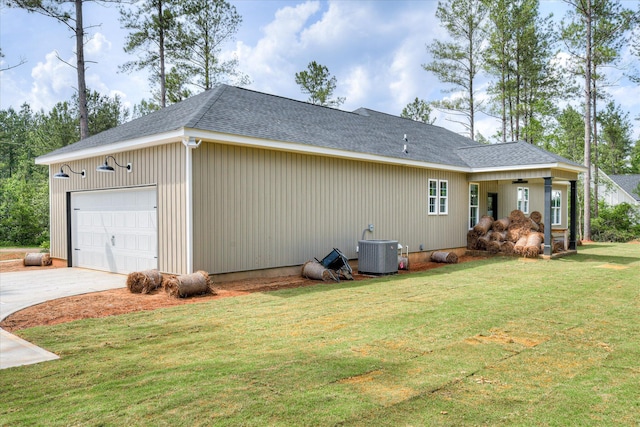 109 Dogwood Trl, Hephzibah, GA 30815 - view of property exterior with central AC unit, a yard, a garage, concrete driveway, and roof with shingles