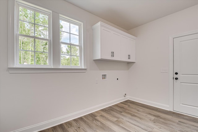 109 Dogwood Trl, Hephzibah, GA 30815 - laundry room featuring electric dryer hookup, cabinet space, hookup for a washing machine, light wood-style floors, and baseboards