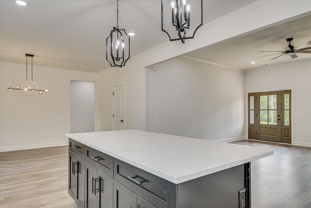 109 Dogwood Trl, Hephzibah, GA 30815 - kitchen with a chandelier, ornamental molding, open floor plan, recessed lighting, and light wood-style flooring