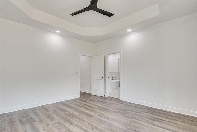 109 Dogwood Trl, Hephzibah, GA 30815 - empty room featuring a raised ceiling, ceiling fan, light wood-type flooring, ornamental molding, and recessed lighting