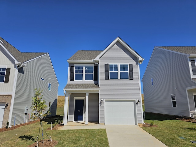 view of front facade featuring a garage and a front lawn