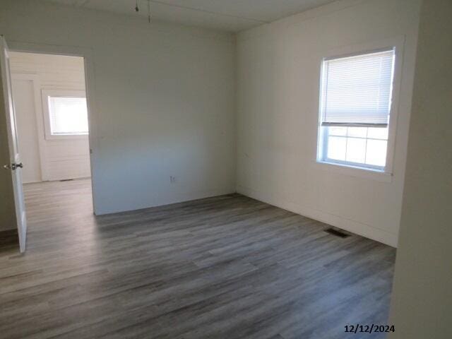 spare room with hardwood / wood-style flooring