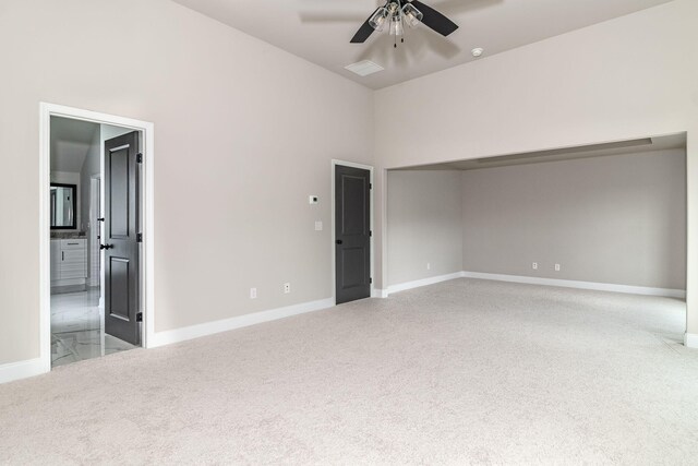 2421 Laurens St, Grovetown, GA 30813 - empty room with carpet flooring, ceiling fan, baseboards, and a towering ceiling