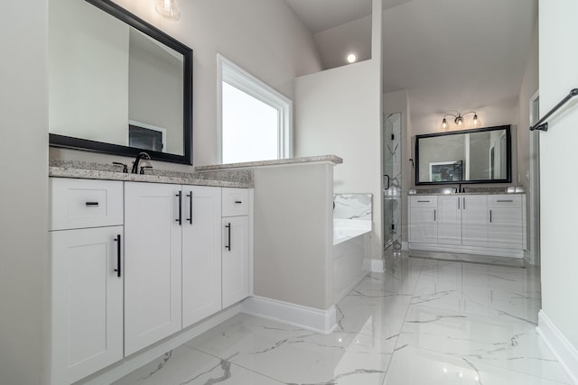 2421 Laurens St, Grovetown, GA 30813 - bathroom featuring baseboards, a marble finish shower, marble finish flooring, and a garden tub