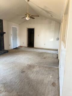 2838 Pepperdine Dr, Hephzibah, GA 30815 - unfurnished living room with carpet floors, a ceiling fan, baseboards, and high vaulted ceiling