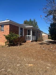 view of front of property featuring brick siding