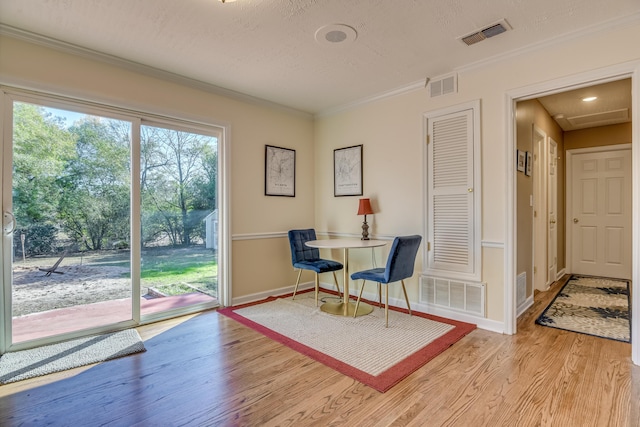 1612 Fairwood Dr, Augusta, GA 30909 - sitting room with light wood-style floors, ornamental molding, and a textured ceiling