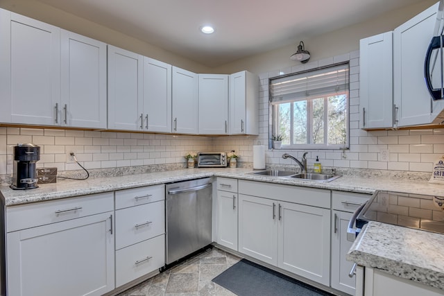 1612 Fairwood Dr, Augusta, GA 30909 - kitchen with stainless steel dishwasher, decorative backsplash, recessed lighting, white cabinets, and electric range