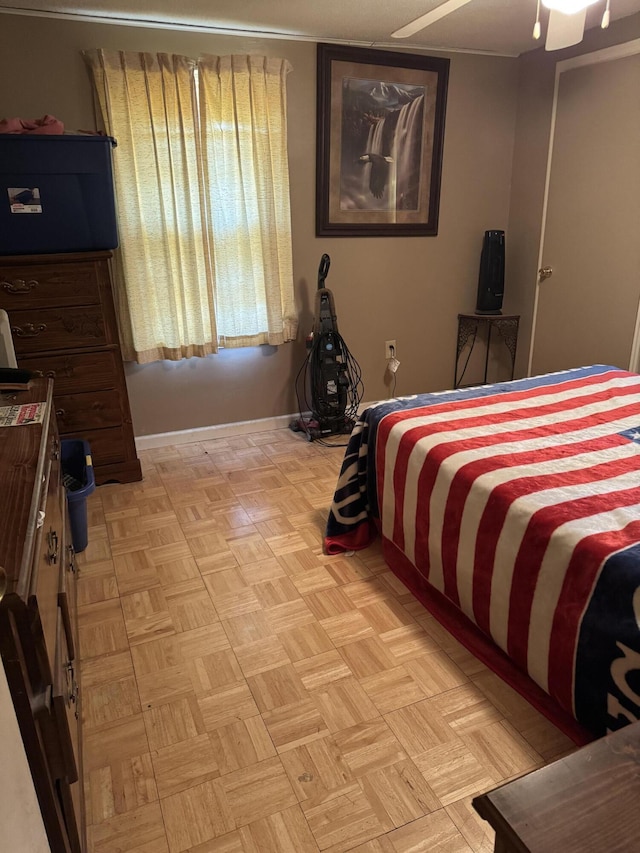 bedroom with light parquet flooring