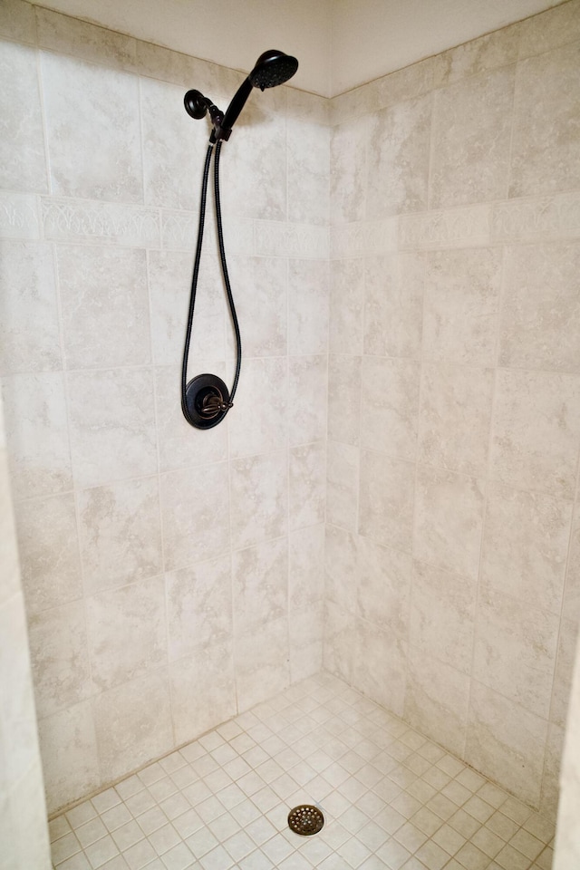 bathroom with tiled shower