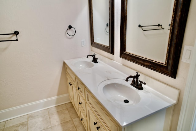 bathroom featuring tile patterned flooring and vanity