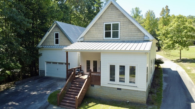 view of front of property with french doors and a garage