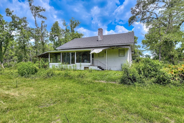 2910-2920 Milledgeville Rd, Augusta, GA 30904 - back of property featuring a shingled roof, a chimney, and a sunroom