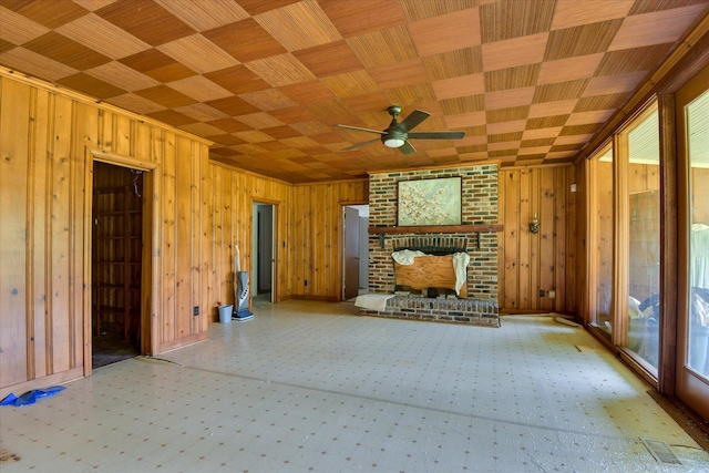 2910-2920 Milledgeville Rd, Augusta, GA 30904 - unfurnished living room with plenty of natural light, wood walls, ceiling fan, and a brick fireplace
