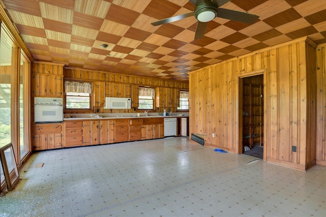 2910-2920 Milledgeville Rd, Augusta, GA 30904 - kitchen with white appliances, wooden walls, light floors, ceiling fan, and light countertops