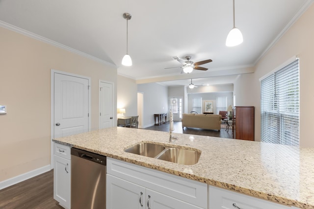 kitchen featuring white cabinetry, sink, pendant lighting, and stainless steel dishwasher