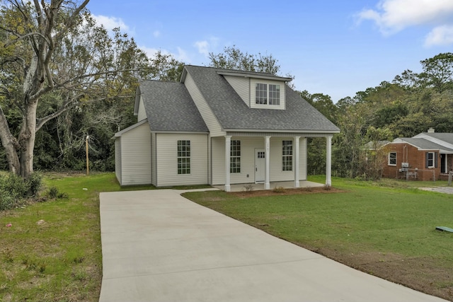 view of front of house with covered porch and a front lawn