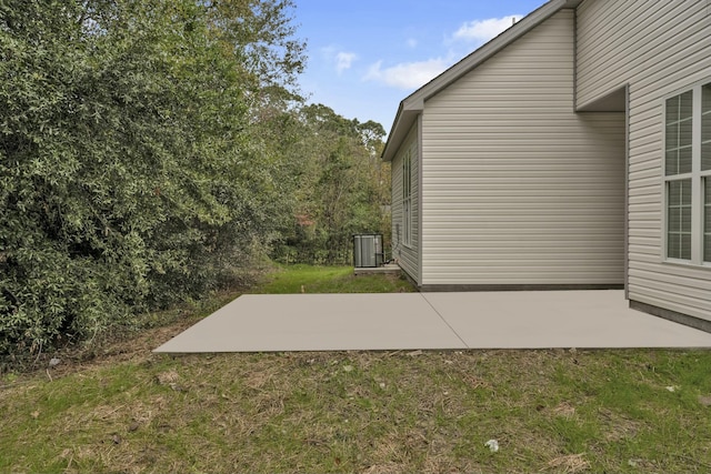 exterior space featuring central AC unit and a patio