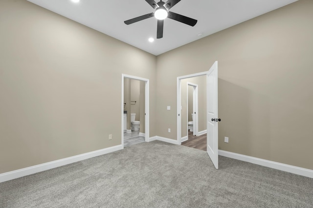 empty room featuring carpet floors and ceiling fan