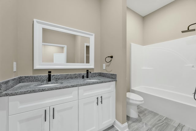 full bathroom featuring shower / bathing tub combination, vanity, and toilet