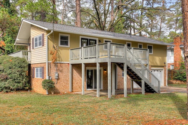 back of house with a wooden deck and a yard