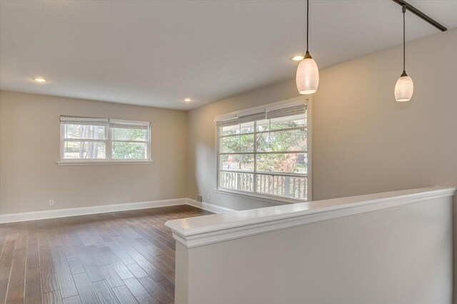 unfurnished room featuring dark hardwood / wood-style floors