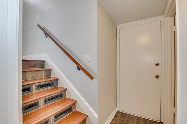 staircase featuring hardwood / wood-style floors