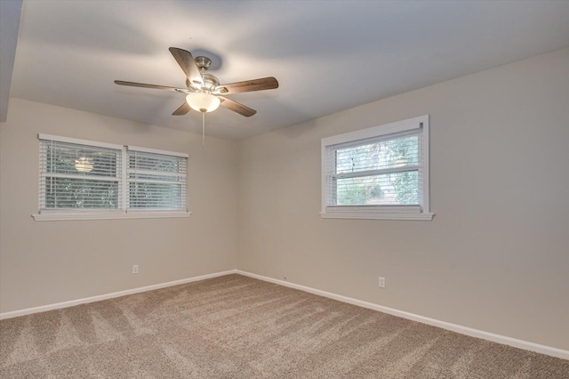 spare room with carpet and ceiling fan