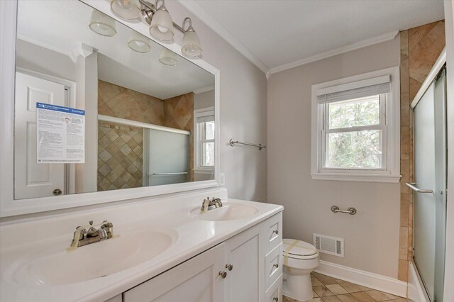 full bathroom featuring combined bath / shower with glass door, tile patterned floors, ornamental molding, vanity, and toilet